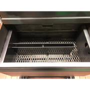 American Barbecue Systems Pit-Boss firebox top-down view showing flat steel floor and rotisserie rod mounts