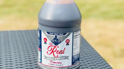 Man Meat BBQ Sweet & Smoky BBQ Sauce bottle on table showcasing its label and design.