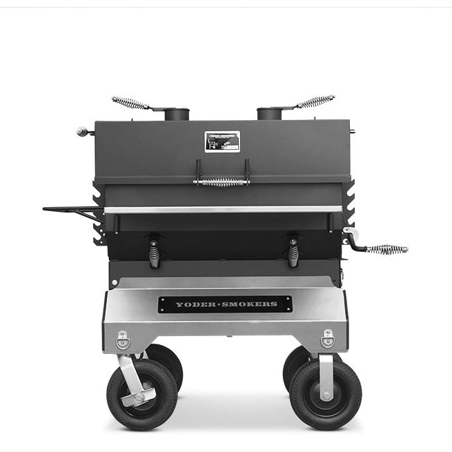 Yoder Smokers competition charcoal grill on a cart with rugged design and precision features for outdoor cooking.