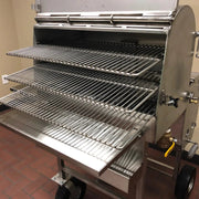 American Barbecue Systems Stainless Steel All-Star rear view showing firebox damper, grease drain valve, and wheel configuration