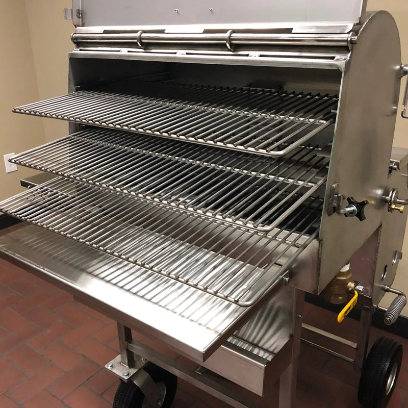 American Barbecue Systems Stainless Steel All-Star rear view showing firebox damper, grease drain valve, and wheel configuration