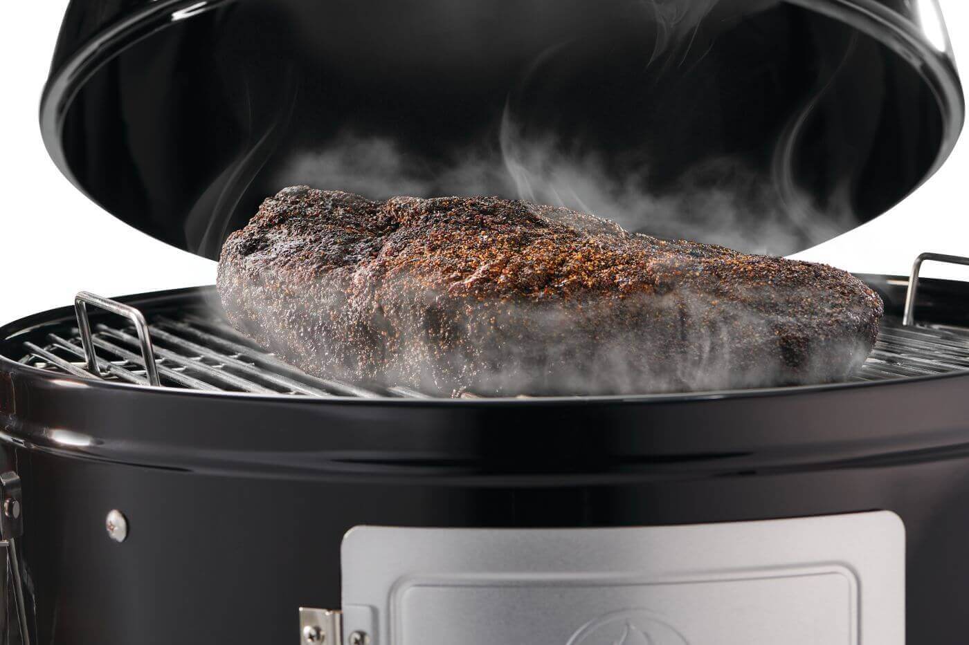 Smoky brisket cooking in Napoleon Grills Apollo 18 charcoal water smoker with lid open.