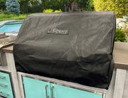Alfresco Premium 36 inch grill cover protecting built-in grill from the elements in outdoor kitchen.