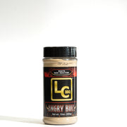 A bottle of LC BBQ Angry Bull beef injection seasoning, featuring a black cap and a black label with gold and red accents, set against a plain white background.