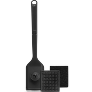 Black spatula and cleaning tools on a white background