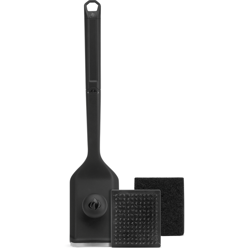 Black spatula and cleaning tools on a white background