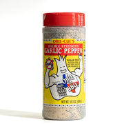 A bottle of Obie-Cue's Double Strength Garlic Pepper seasoning, featuring a bright red cap and a yellow label with the brand's mascot, on a white background.