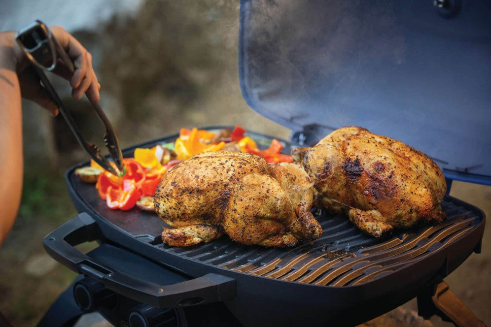 Cooking two whole chickens on the Napoleon Grills TravelQ™ 285 portable gas grill with griddle.