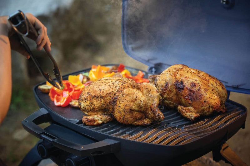 Cooking two whole chickens on the Napoleon Grills TravelQ™ 285 portable gas grill with griddle.