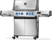 Napoleon Prestige 500 connected grill with stainless steel finish and blue LED controls.