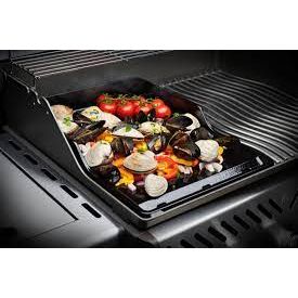 Delicious seafood and vegetables cooking on a Napoleon 2-sided porcelain-enameled cast-iron griddle for Prestige 500 series.