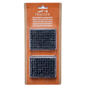 Traeger replacement cleaning brush set in its original brown cardboard blister packaging, showing two black textured brush heads.