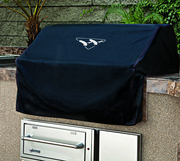 Built-in grill cover for teppanyaki protecting stainless steel grill from the elements in an outdoor kitchen.